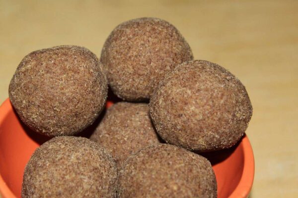 Organic Finger Millet Ragi Laddu is a power-packed, nutrient-rich food snack made from wholesome finger millet, perfect for healthy snacking. Rich in calcium, iron, and fiber, these laddus are ideal for both kids and adults. A thoughtful and health-focused addition to a Rakhi set, they’re available in convenient pack sizes of point twenty five kilogram, point five kilogram, and one kilogram. Buy this traditional and tasty food online to support your wellness journey the delicious way.